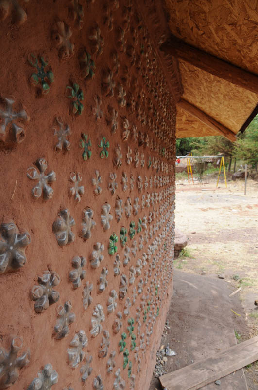 Parents made a library from earth filled plastic bottles